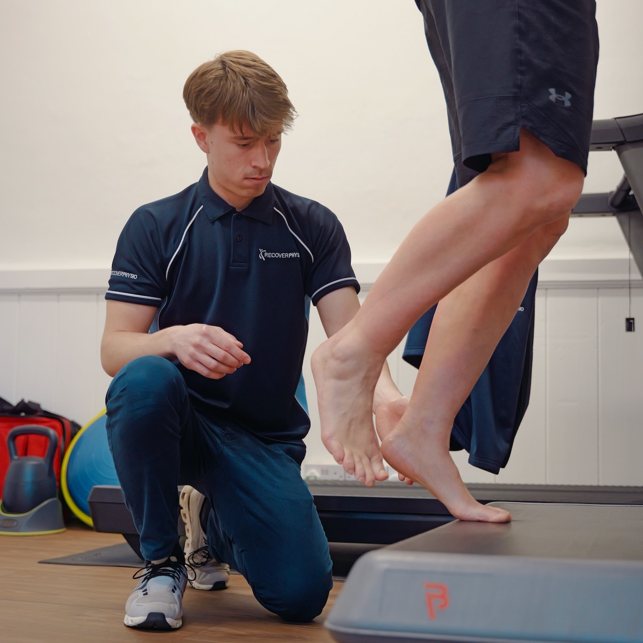 Henry conducts a physio assessment at Recover Physio